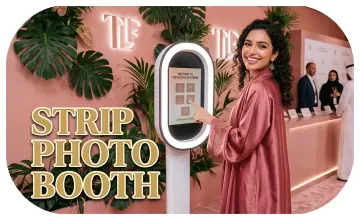 Guests having fun with quirky props inside a vintage strip photo booth by Mirror Booth Dubai.